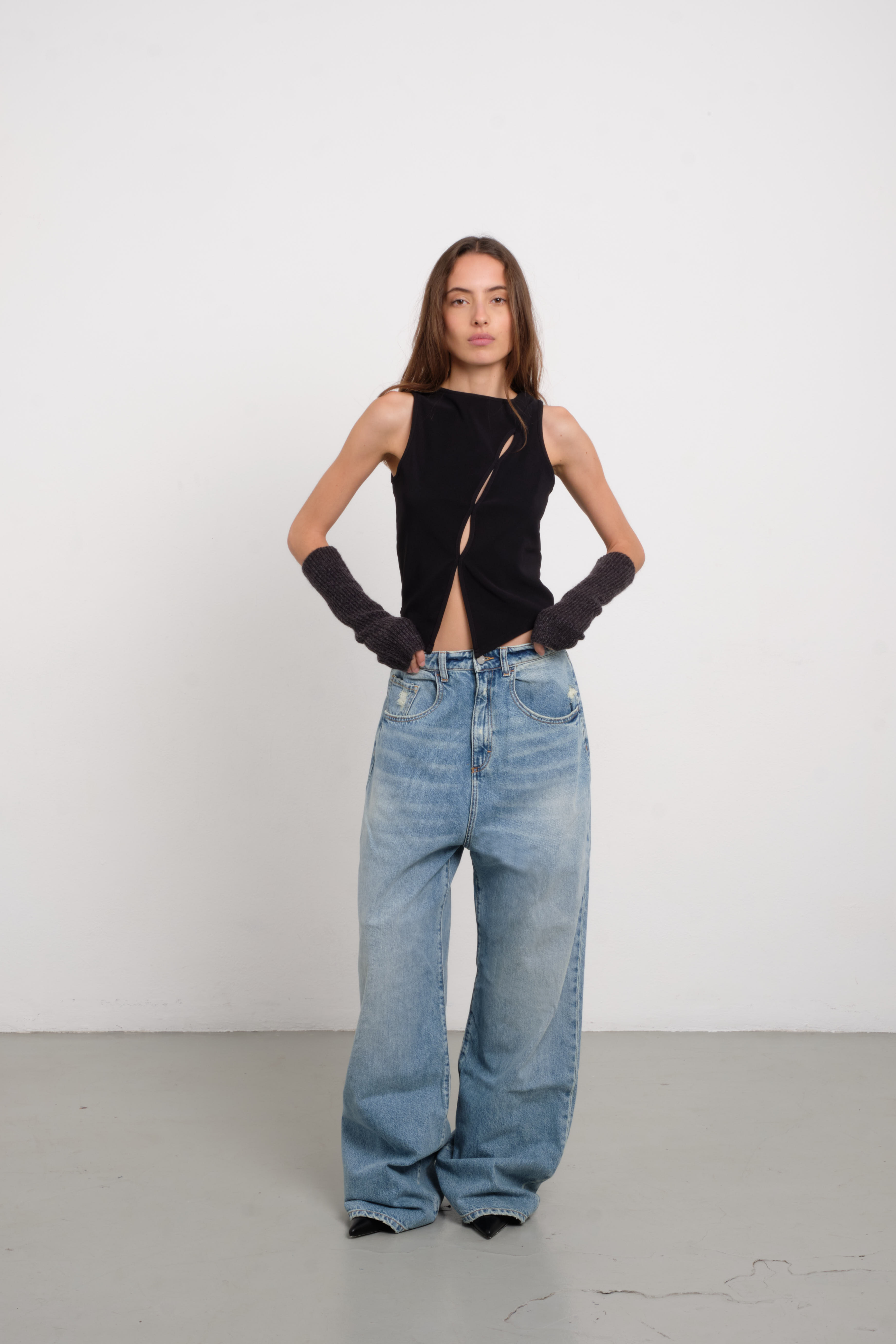Coco women’s wide leg jeans in light wash, 100% rigid cotton denim, worn by a model with a black top.
