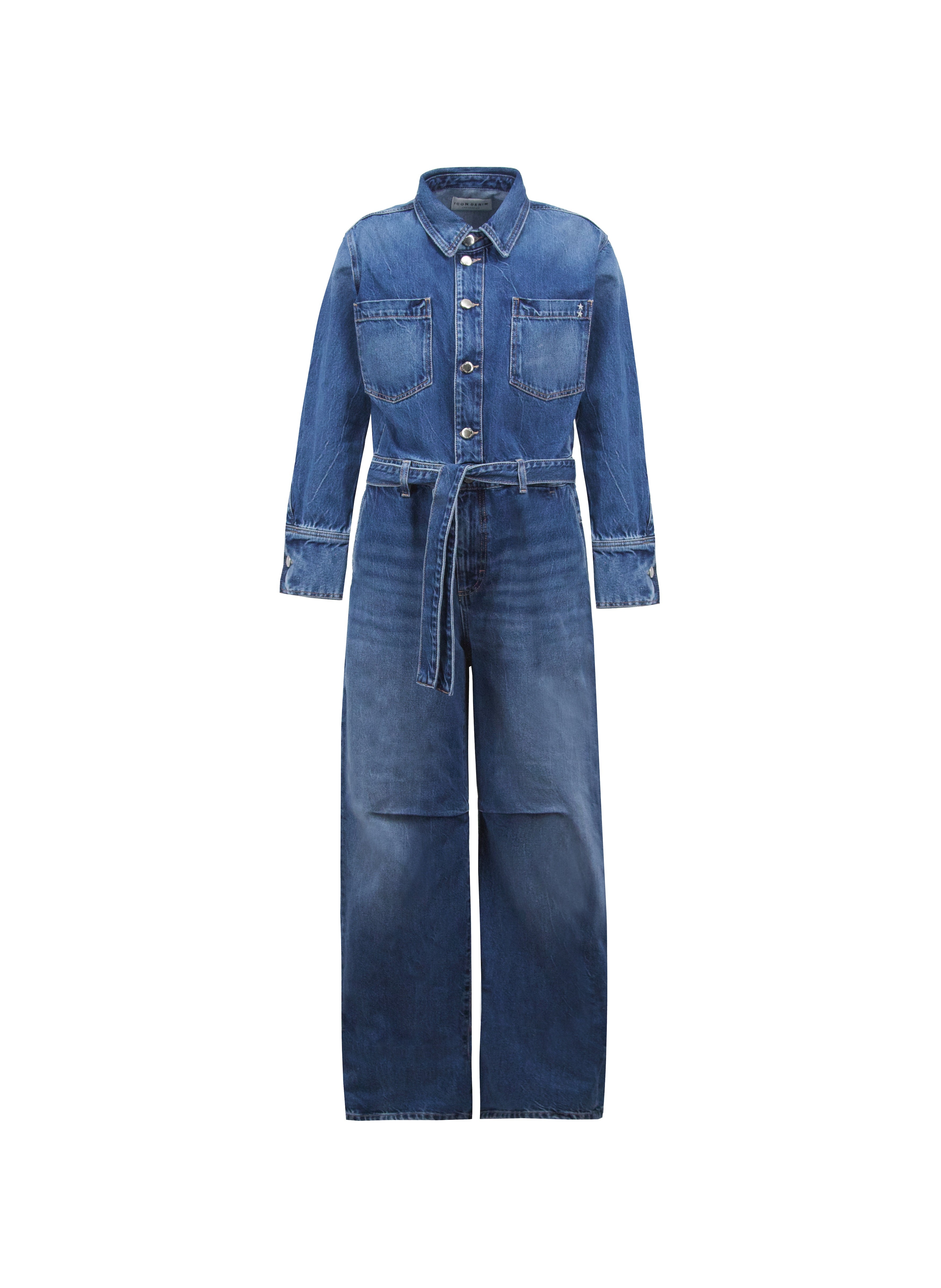 Still life of Indie women’s jumpsuit in eclipse wash, 100% rigid cotton denim.