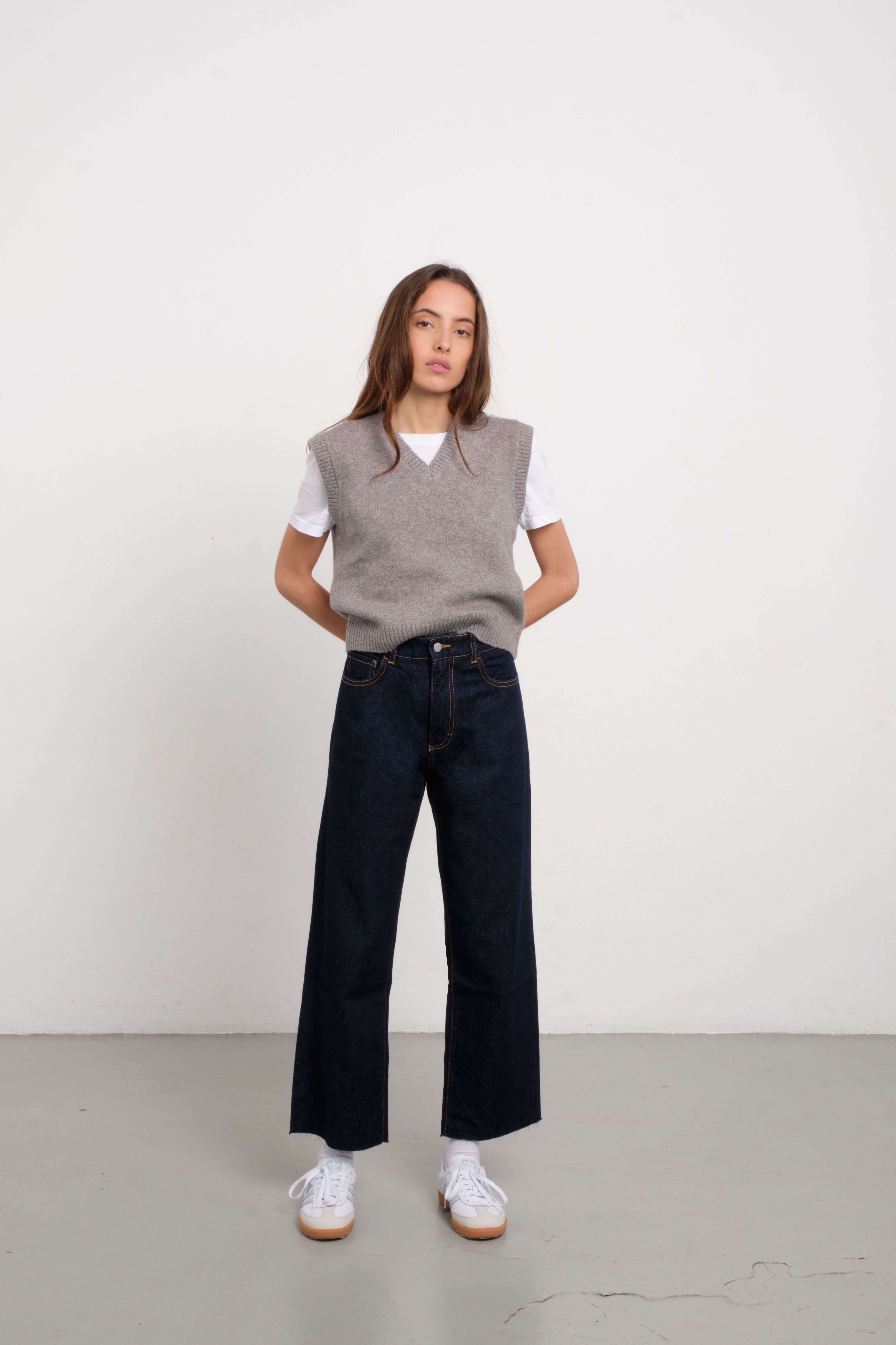Annie women’s straight leg jeans in indigo raw, 100% rigid cotton denim, worn by a model with a white shirt.