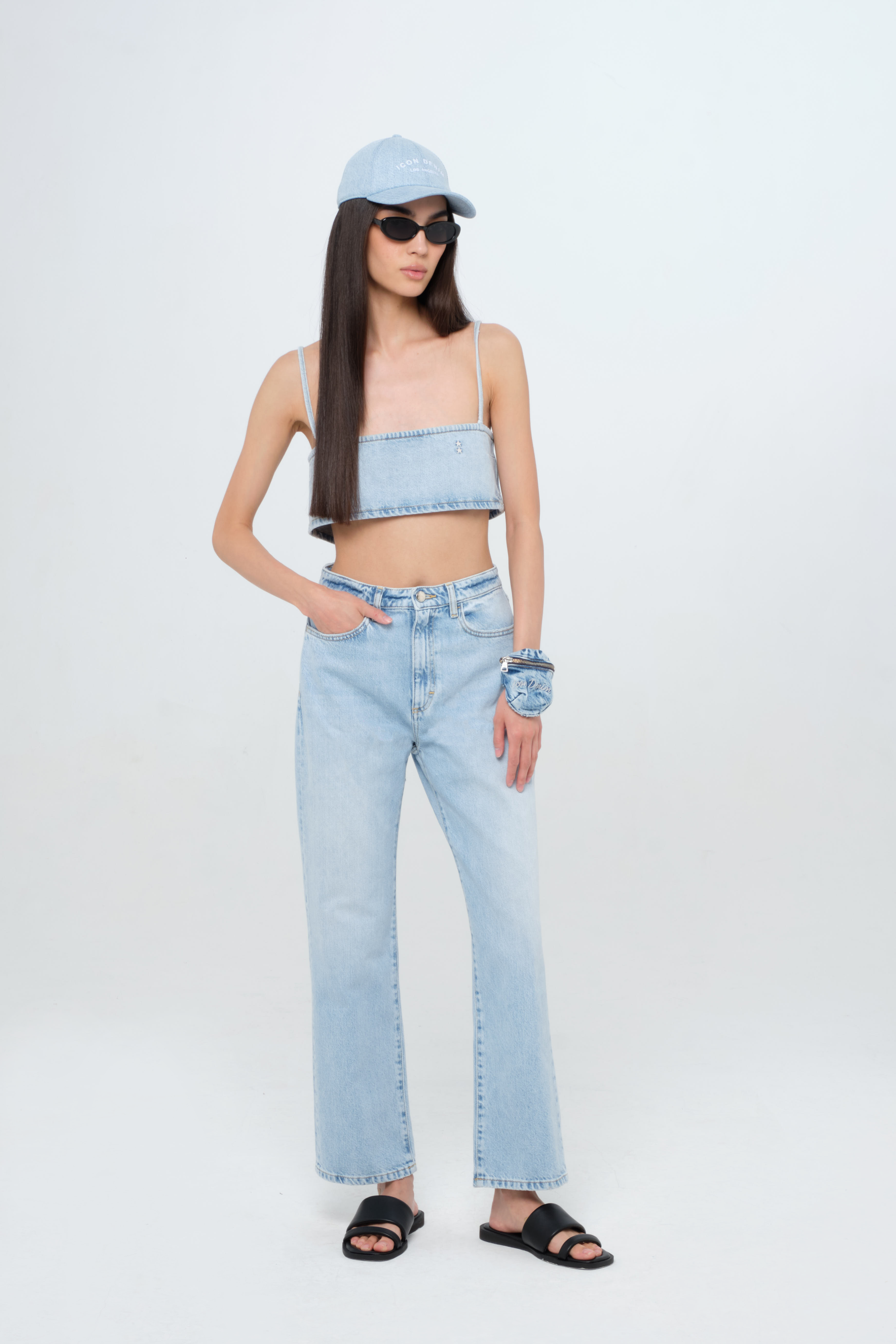 Rose women’s straight leg jeans in light wash, 100% rigid cotton denim, worn by a model with a denim top.