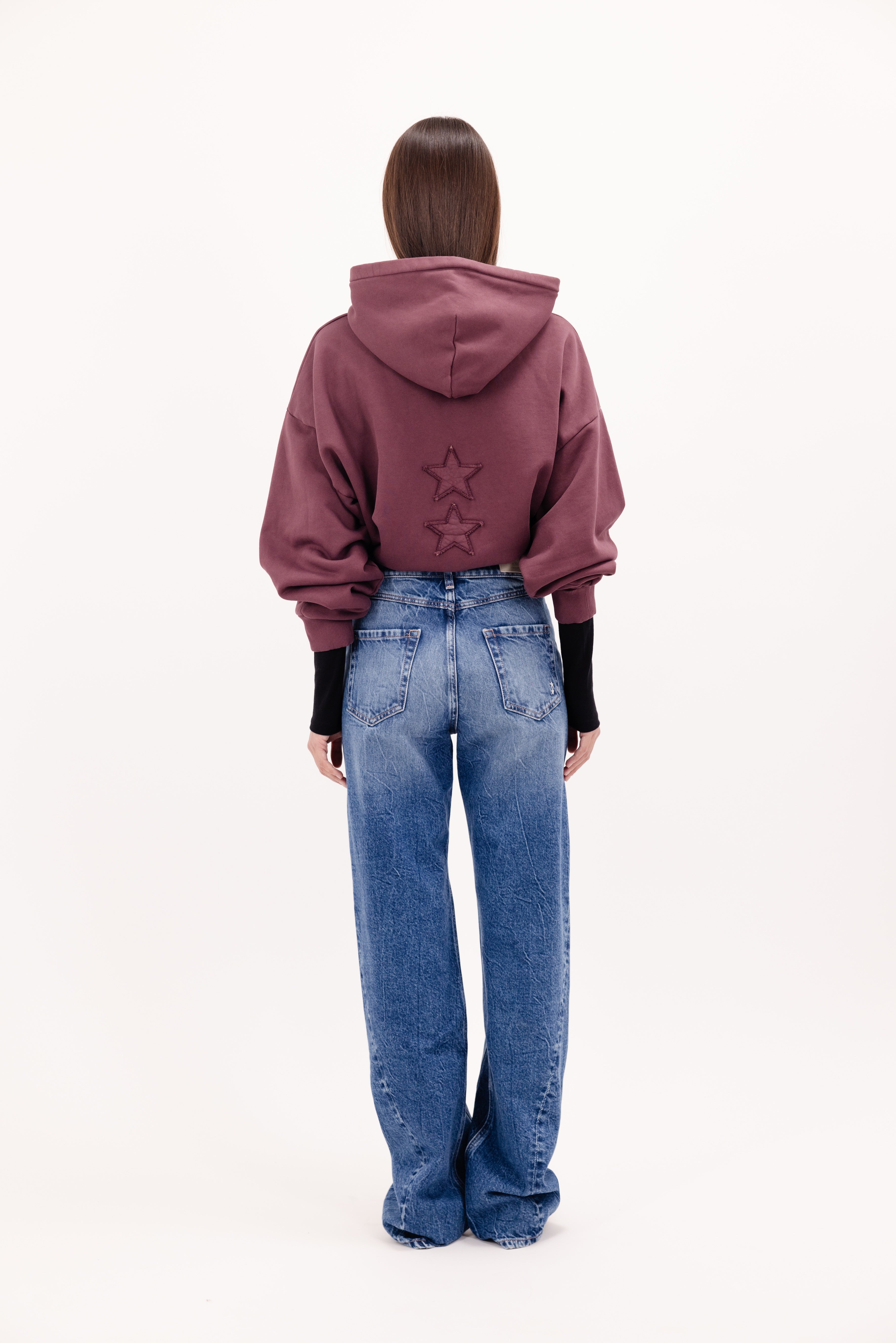 Back view of Annie women’s straight leg jeans in eclipse wash, 100% rigid cotton denim, worn by a model with a cherry sweatshirt.