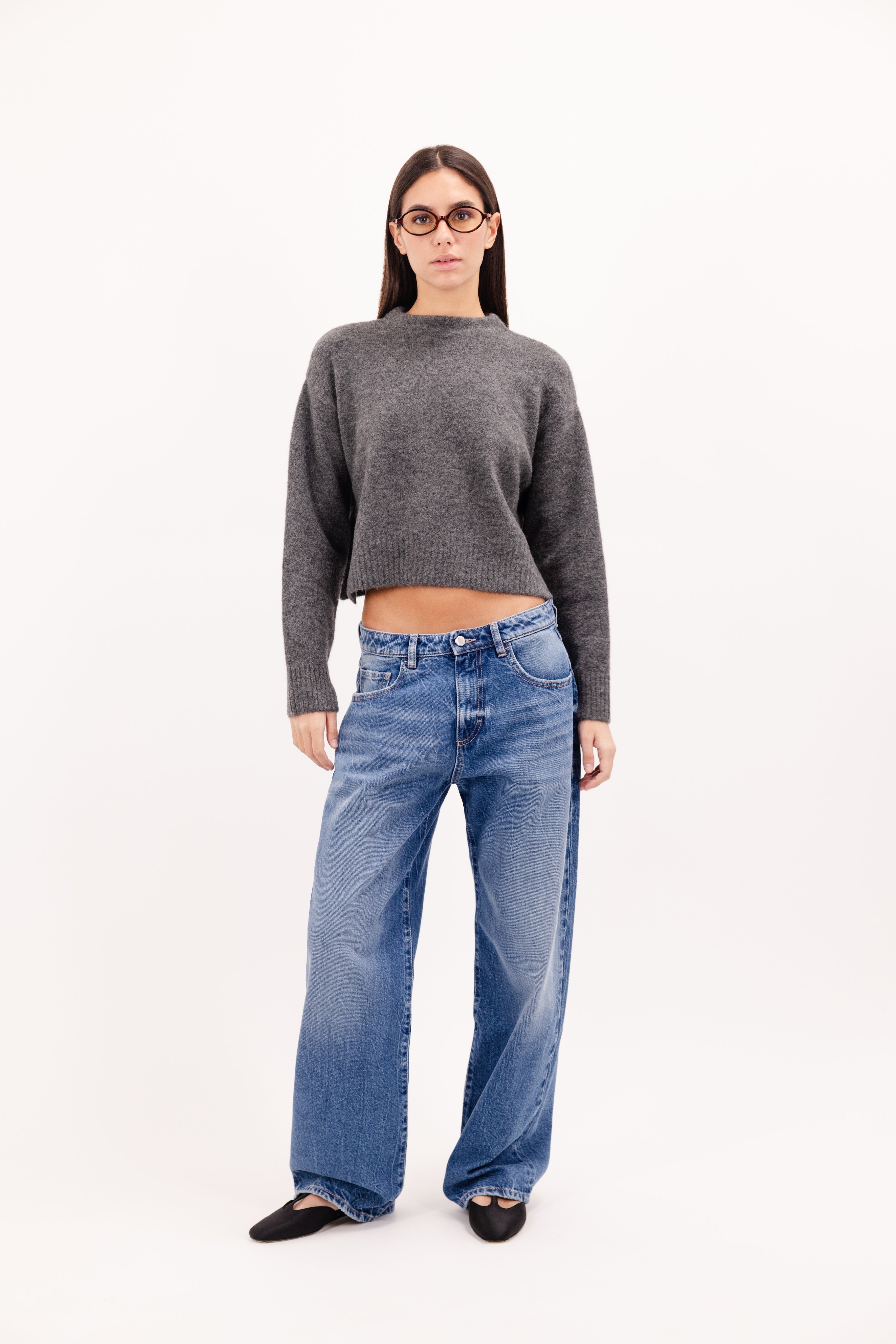 Bea women’s wide leg jeans in eclipse wash, 100% rigid cotton denim, worn by a model with a wool knit.