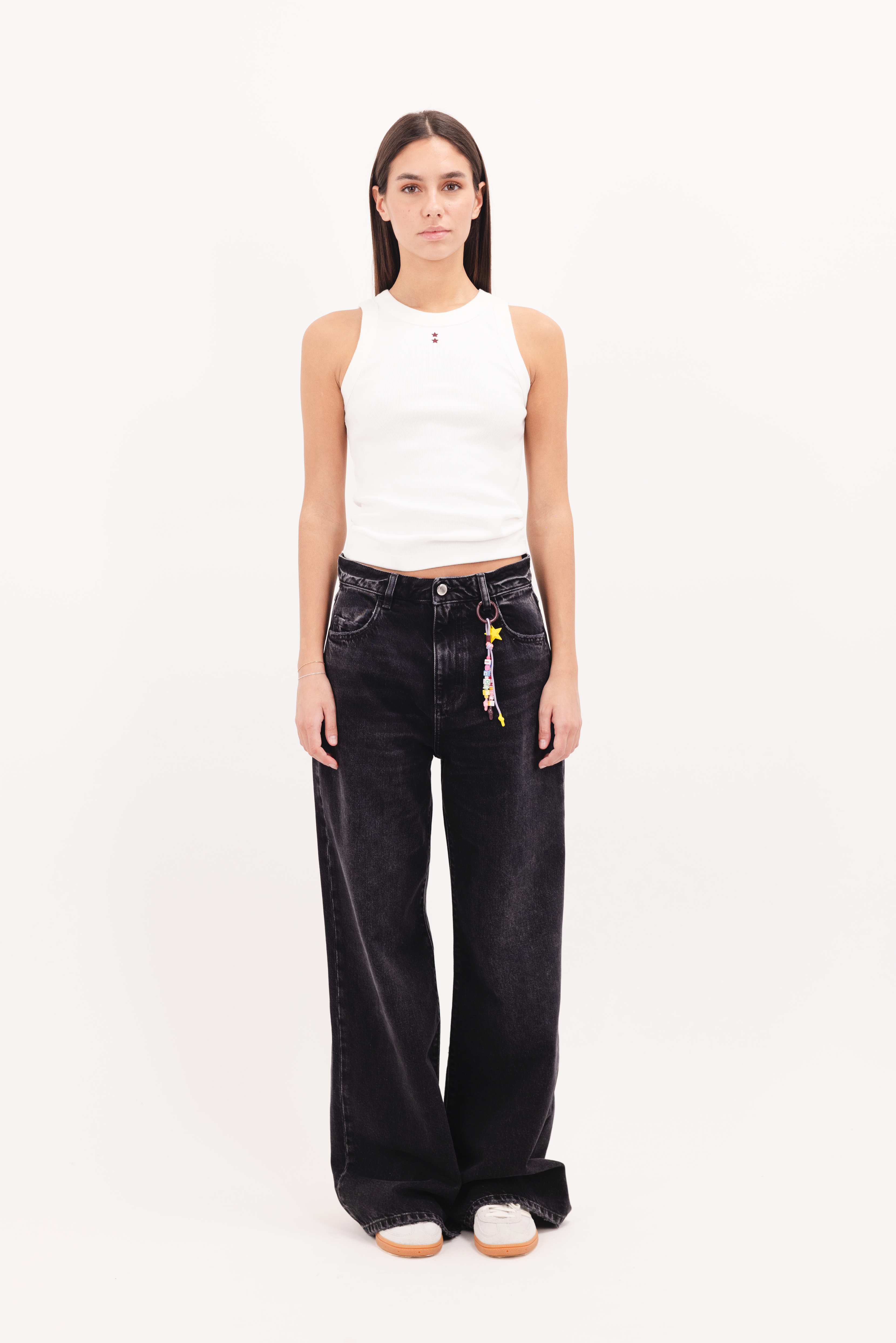 Debby women’s wide leg jeans in graphite black wash, 100% rigid cotton denim, worn by a model with a white top.