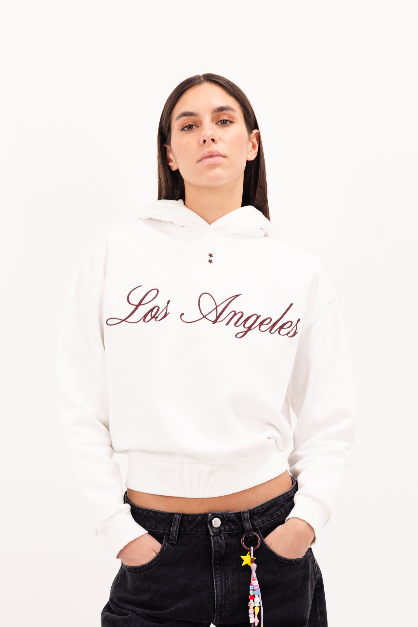 Ebbie women’s hoodie in white, 100% cotton, worn by a model.