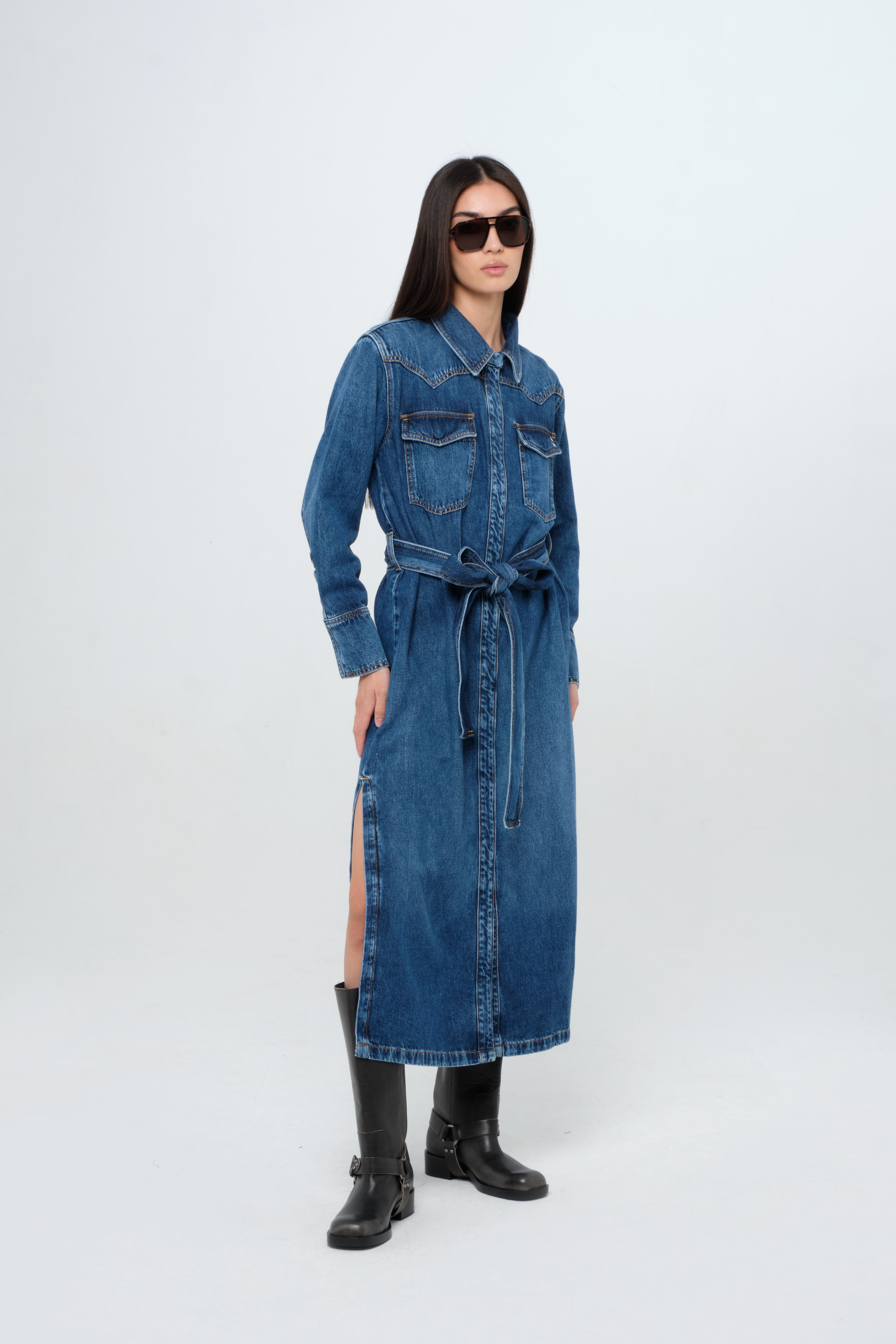 Ellen women’s log dress in dark wash, 100% rigid cotton denim, worn by a model.