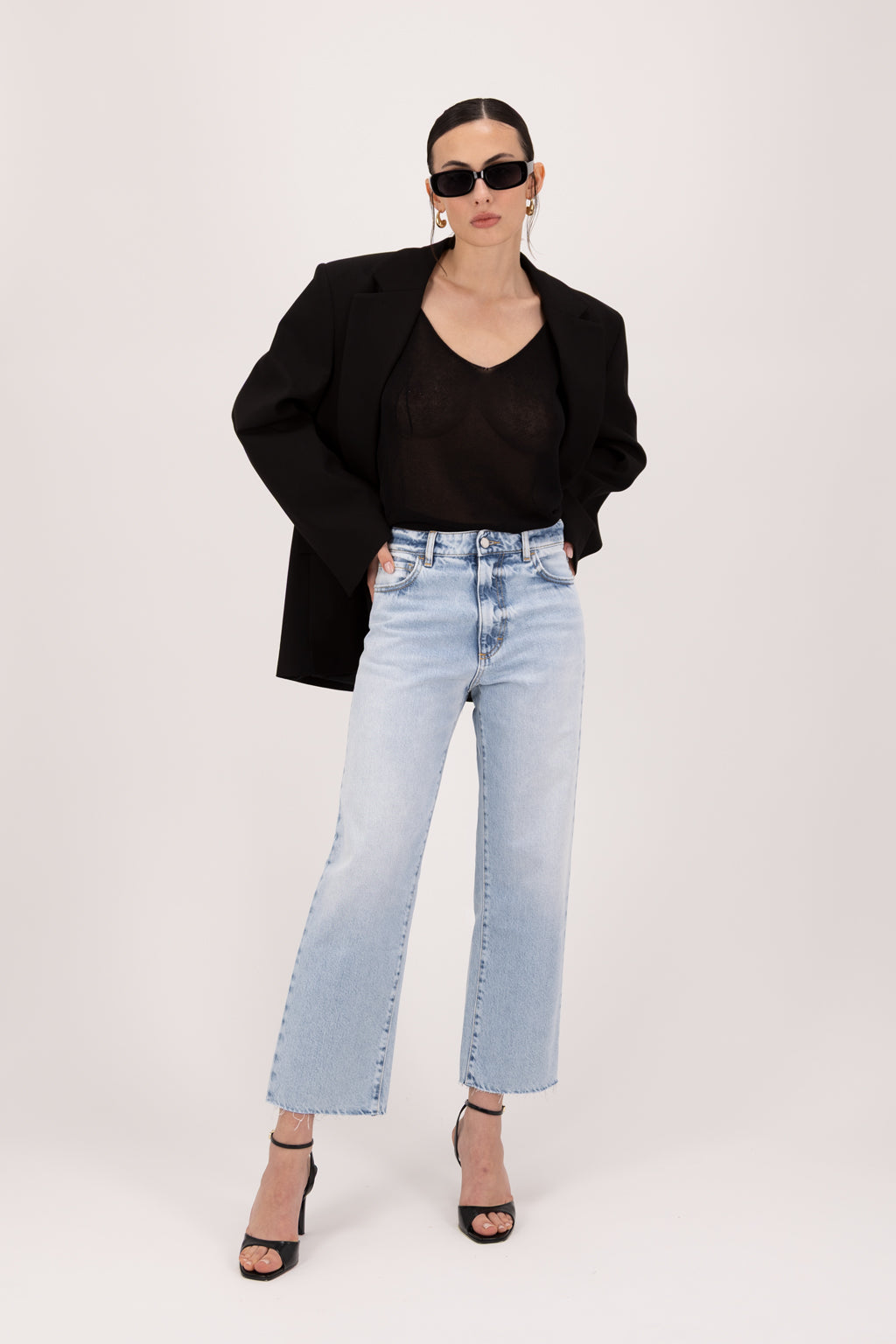 Jill women’s straight leg jeans in sky blue wash, 100% rigid cotton denim, worn by a model with a black top.