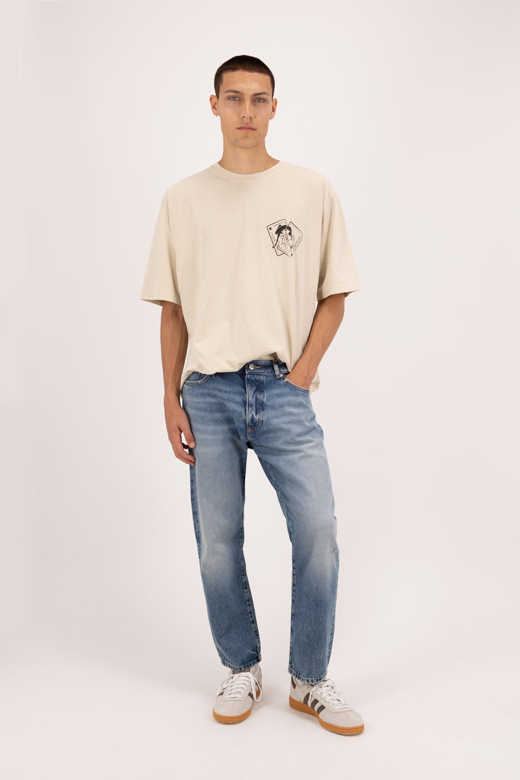 Josh men’s carrot jeans in eclipse wash, 100% rigid cotton denim, worn by a model with a desert t-shirt.
