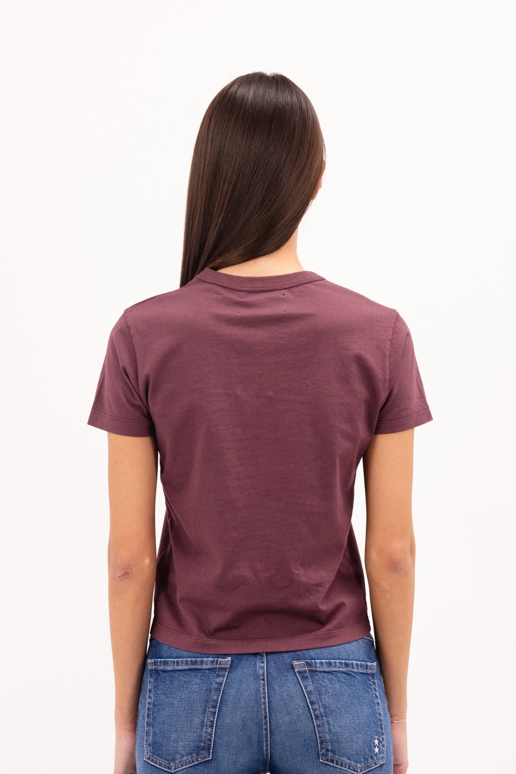 Back view of Julie women’s t-shirt in cherry, 100% cotton, worn by a model with jeans.

