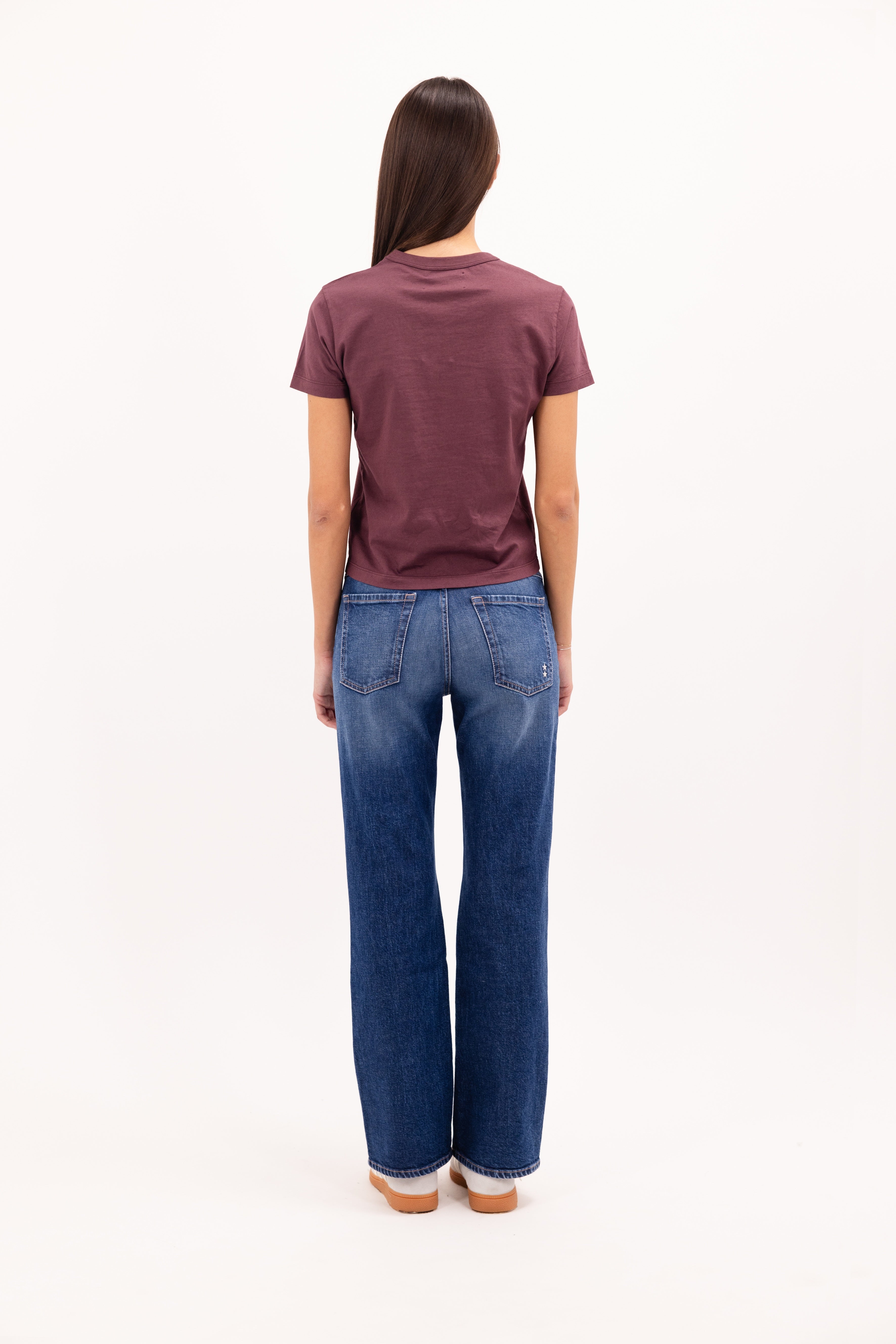 Back view of Julie women’s t-shirt in cherry, 100% cotton, worn by a model with jeans.
