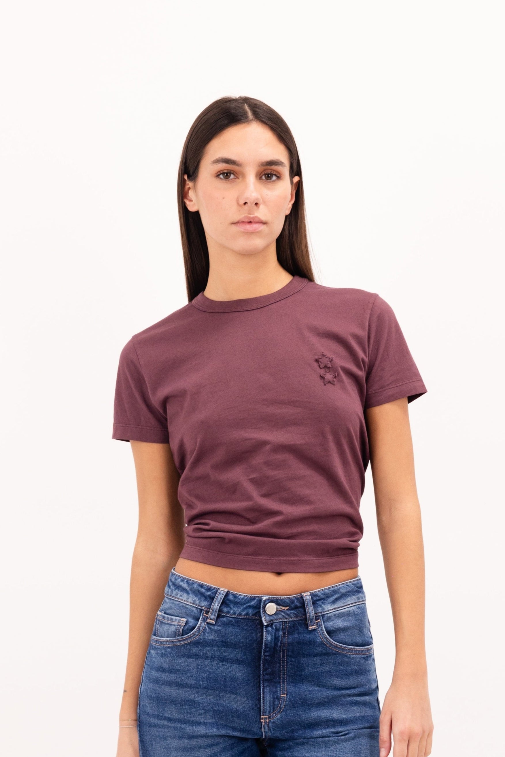Julie women’s t-shirt in cherry, 100% cotton, worn by a model with jeans.
