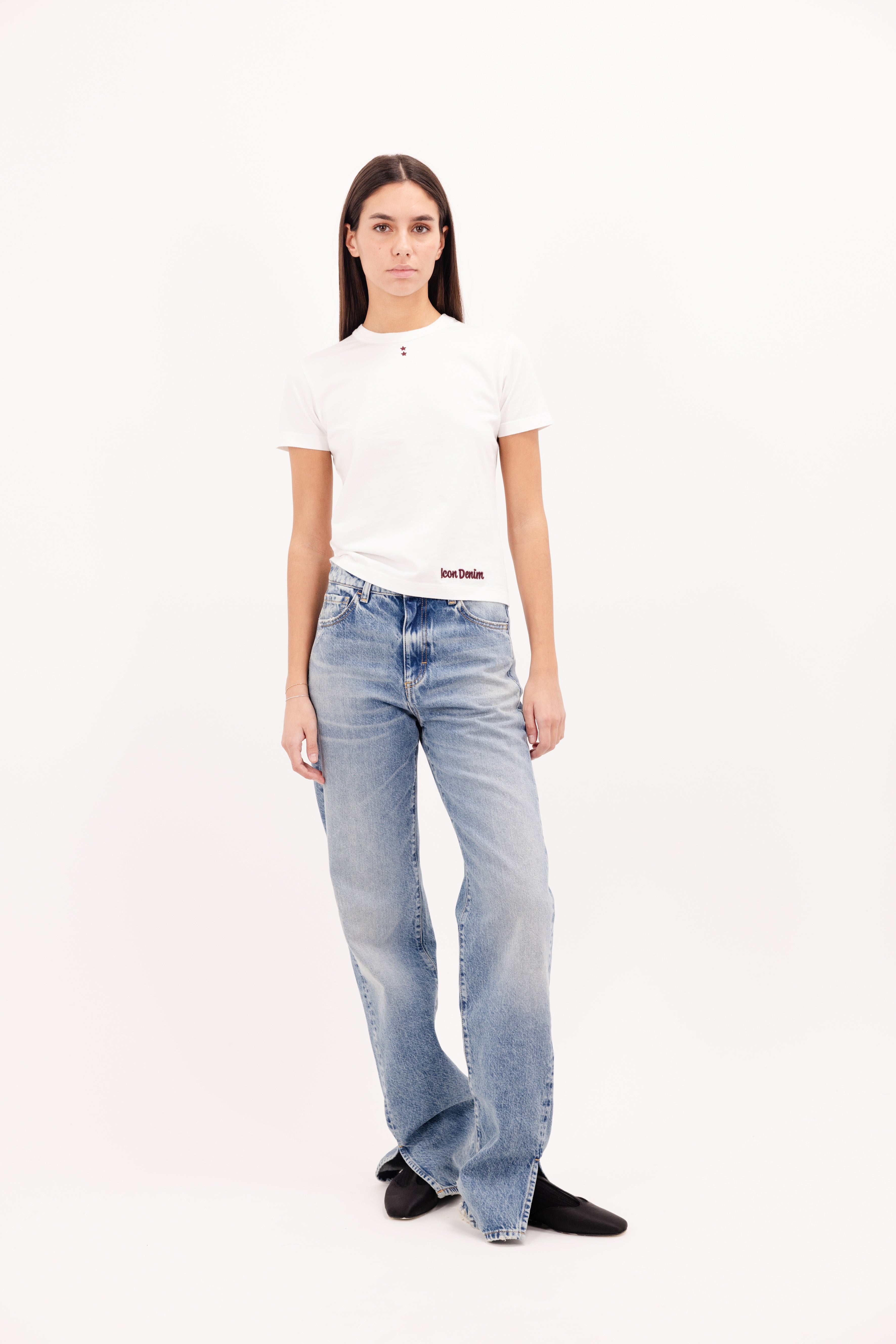 Julie women’s t-shirt in white, 100% cotton, worn by a model with jeans.