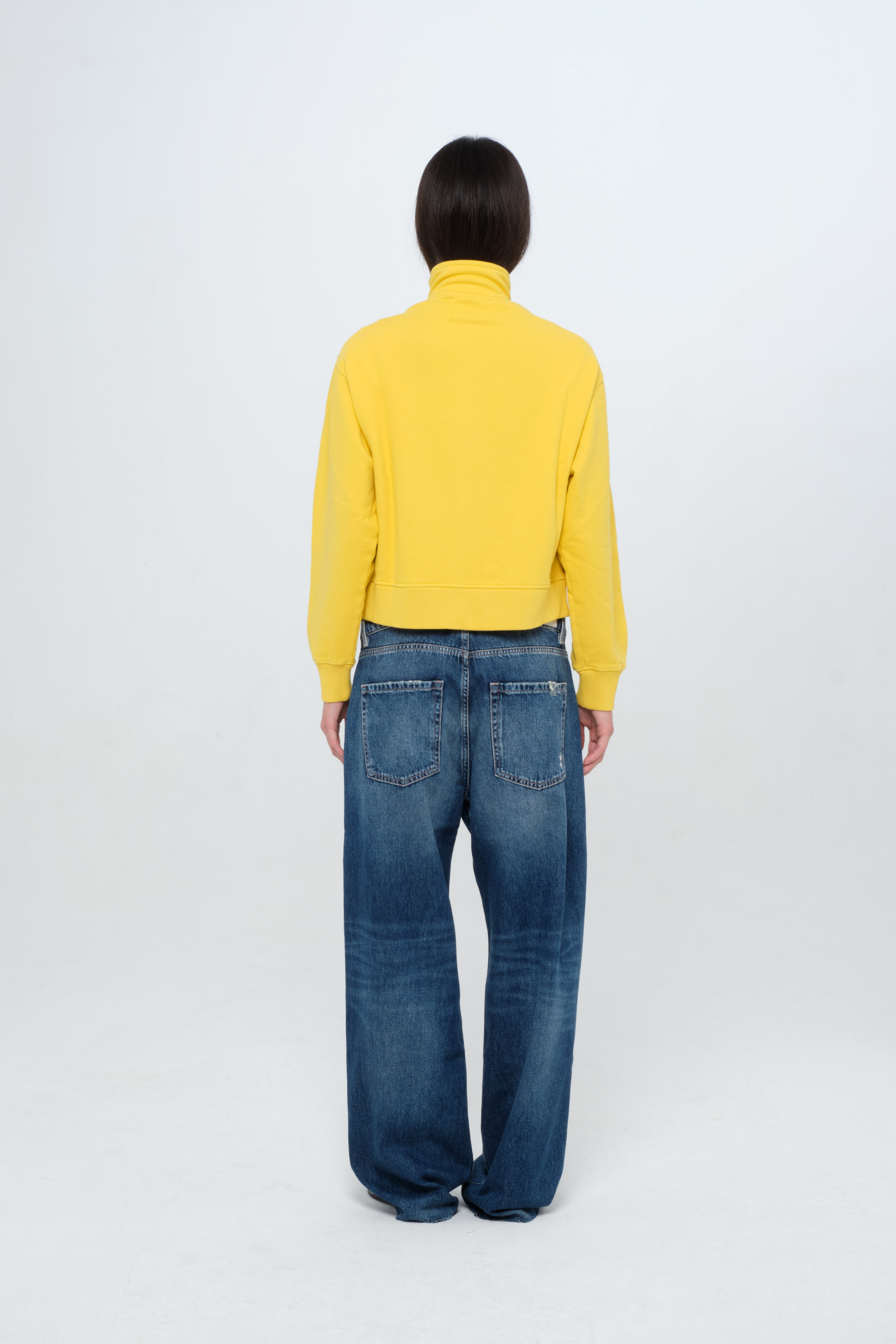 Back view of Kara women’s sweatshirt in sunny, 100% cotton, worn by a model.