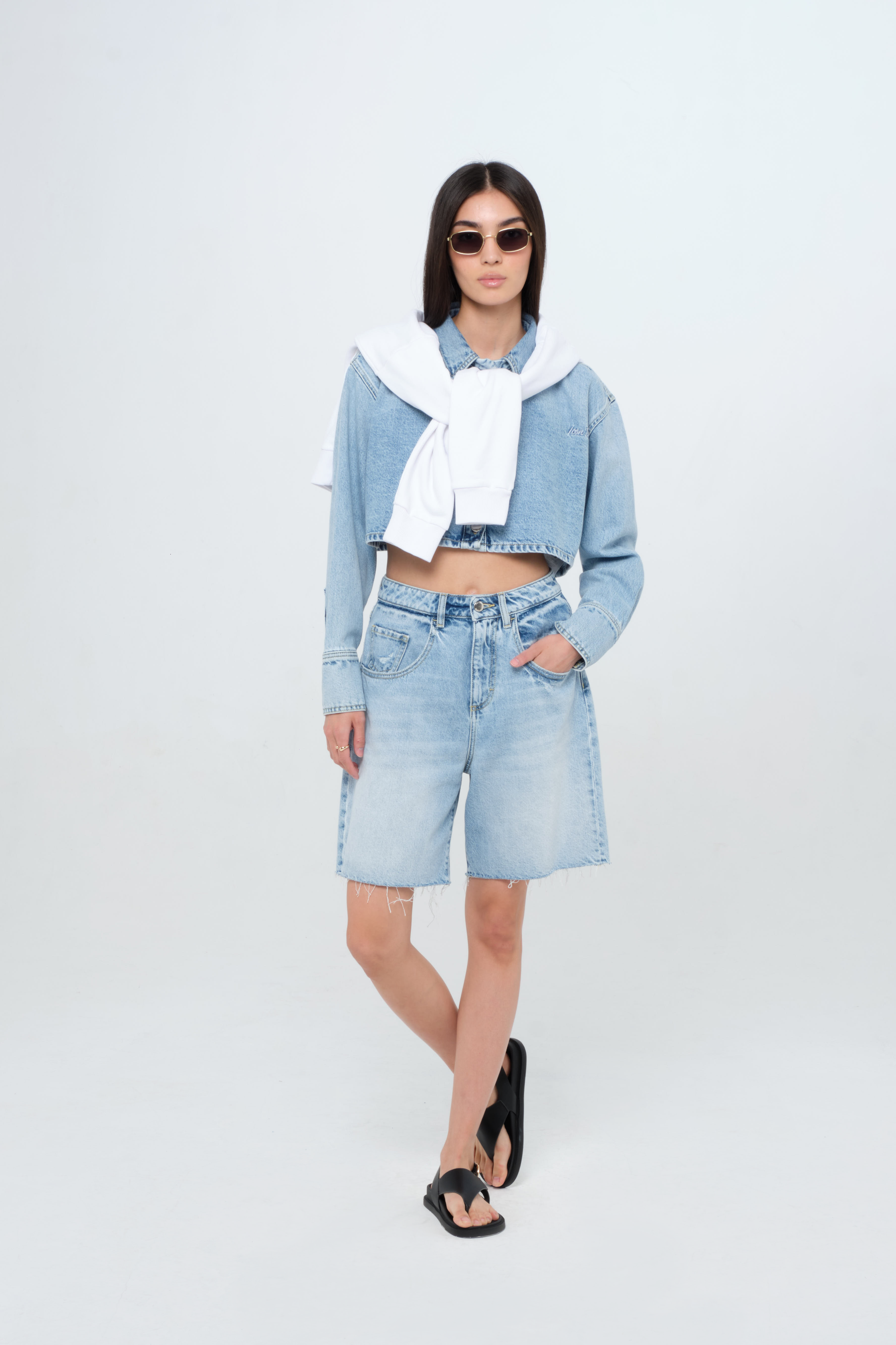 Lea women’s wide leg short  jeans in light wash, 100% rigid cotton denim, worn by a model with a crop denim shirt.