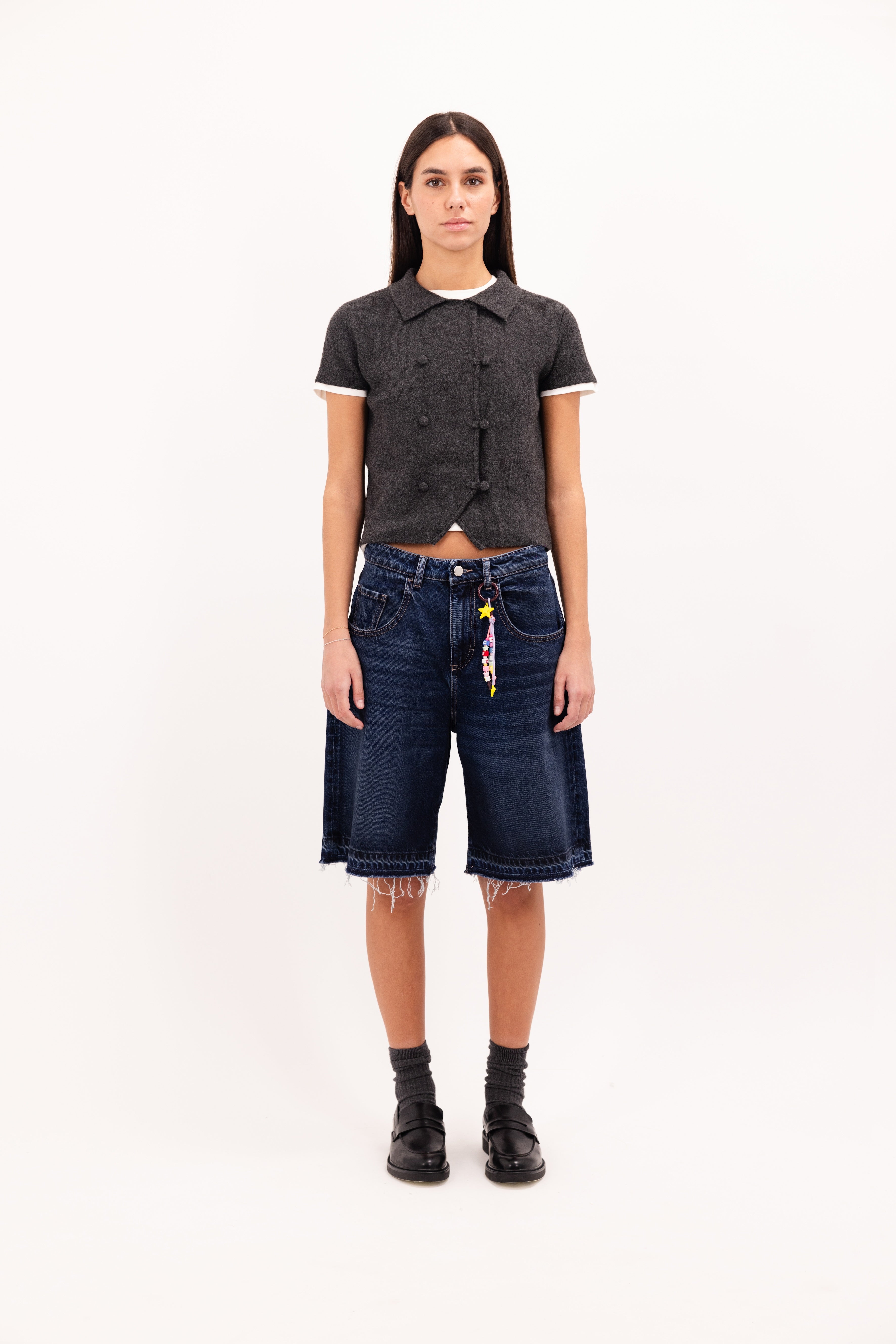 Lulu women’s wide leg short in dusty blue wash, 100% rigid cotton denim, worn by a model with a wool top.