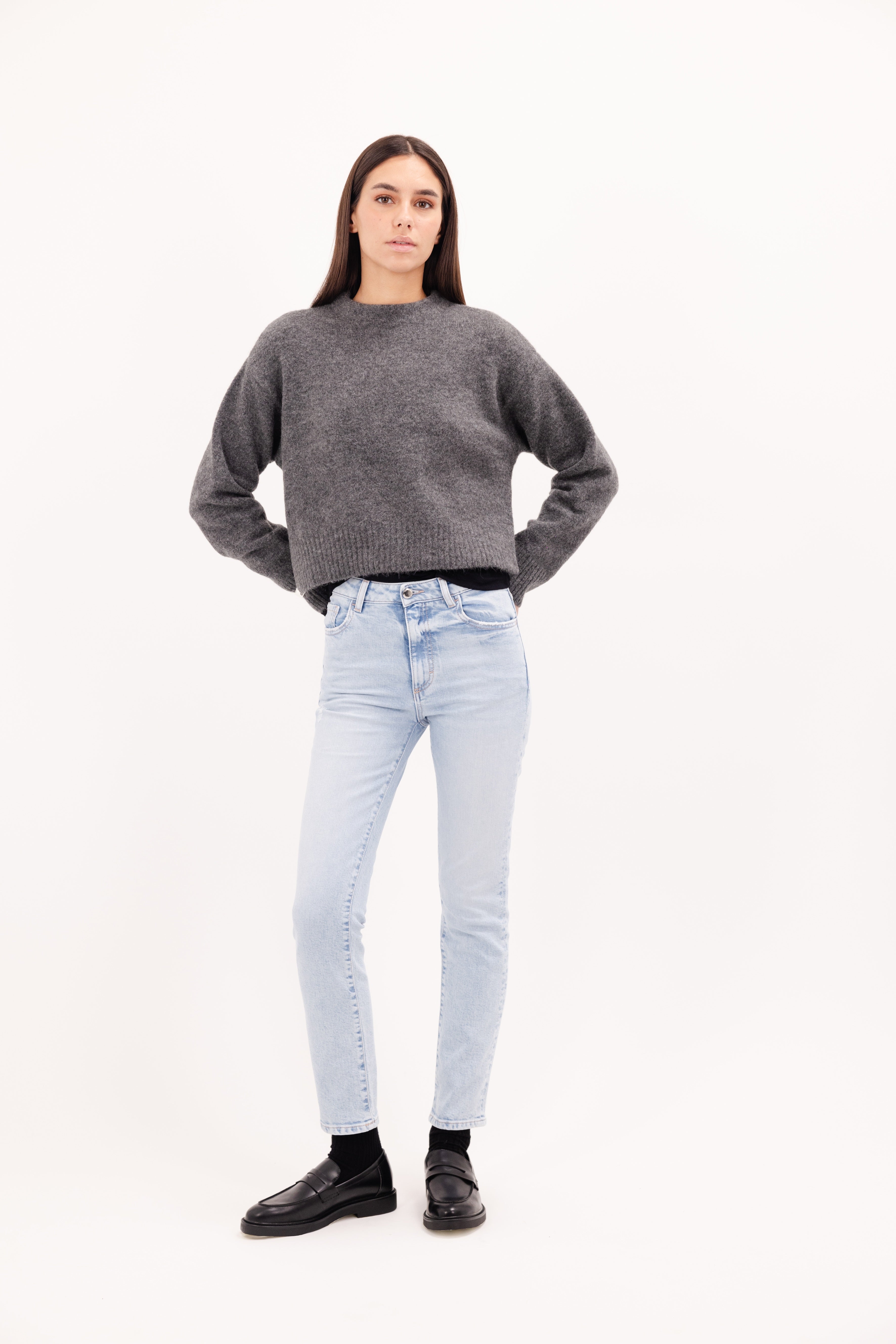 Nana women's slim jeans in sky blue wash, 99% Co + 1% Ela, worn by a model with a gray knit.