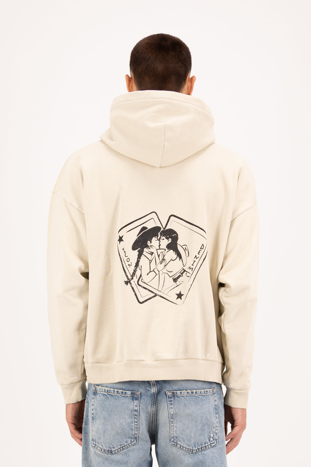 Back view of Owen men’s hoodie in desert, 100% cotton, worn by a model with jeans.