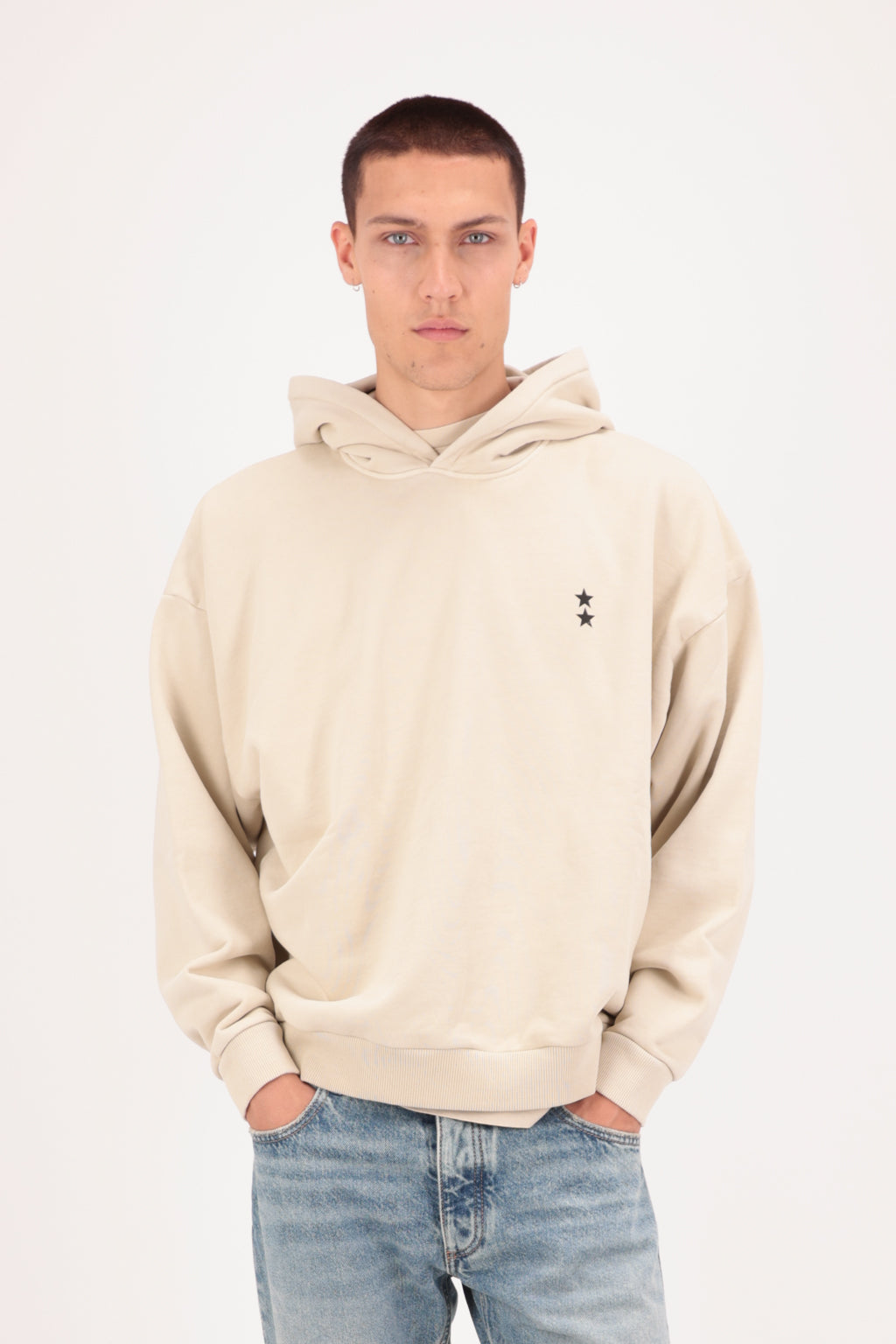 Owen men’s hoodie in desert, 100% cotton, worn by a model with jeans.