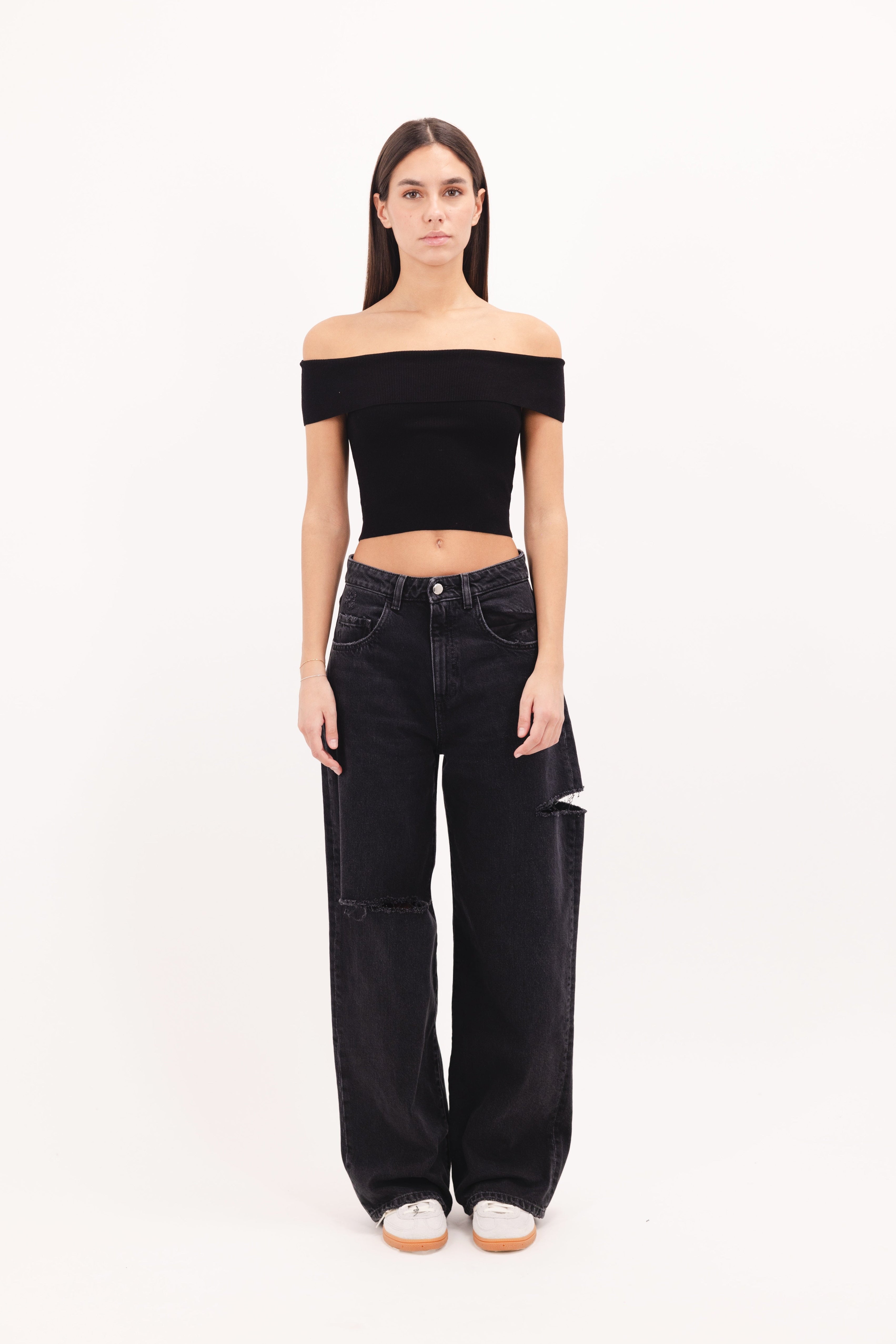 Poppy women’s wide leg jeans in graphite black wash, 100% rigid cotton denim, worn by a model with a black top.