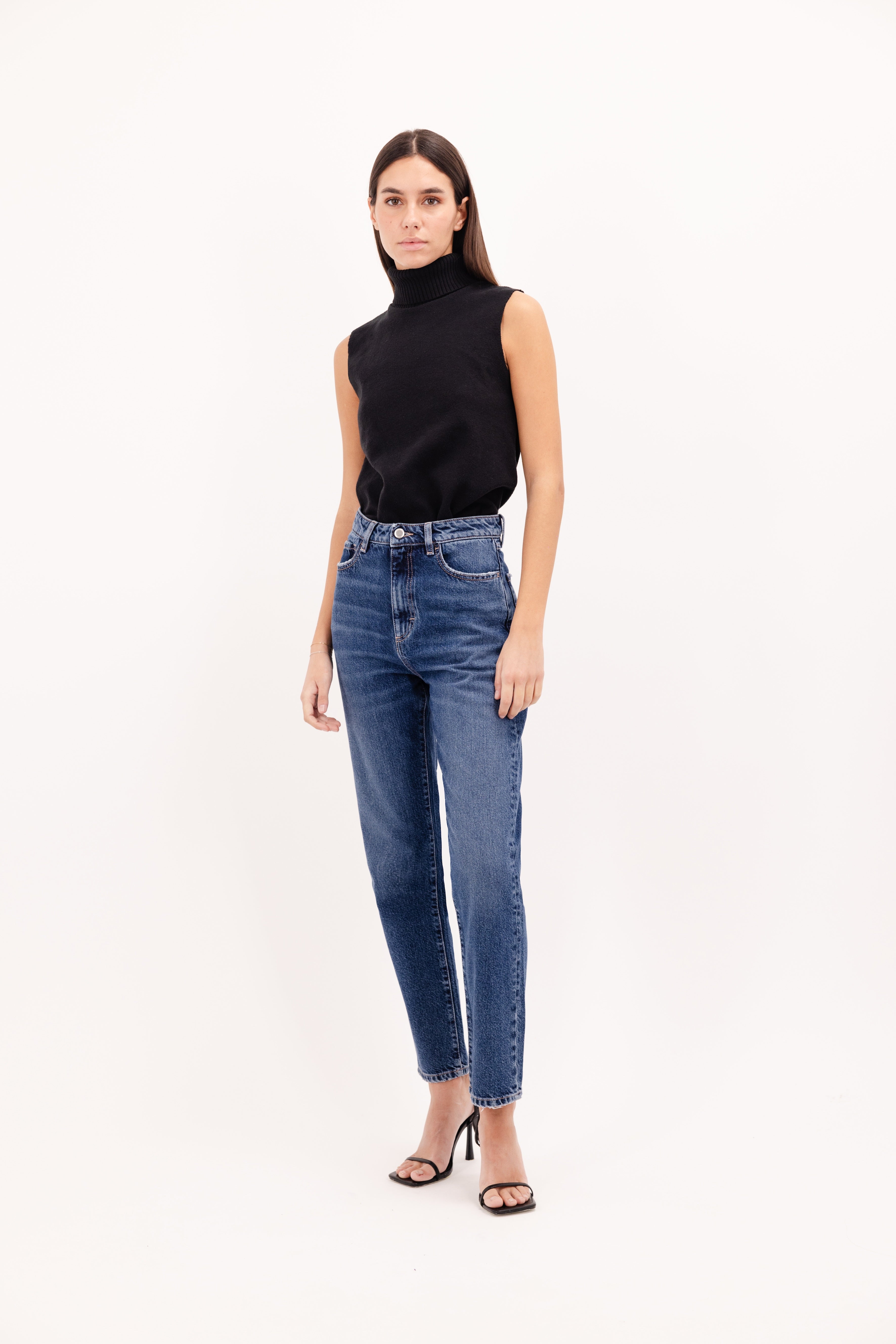 Rory women’s loose jeans in eclipse wash, 100% rigid cotton denim, worn by a model with a black top.