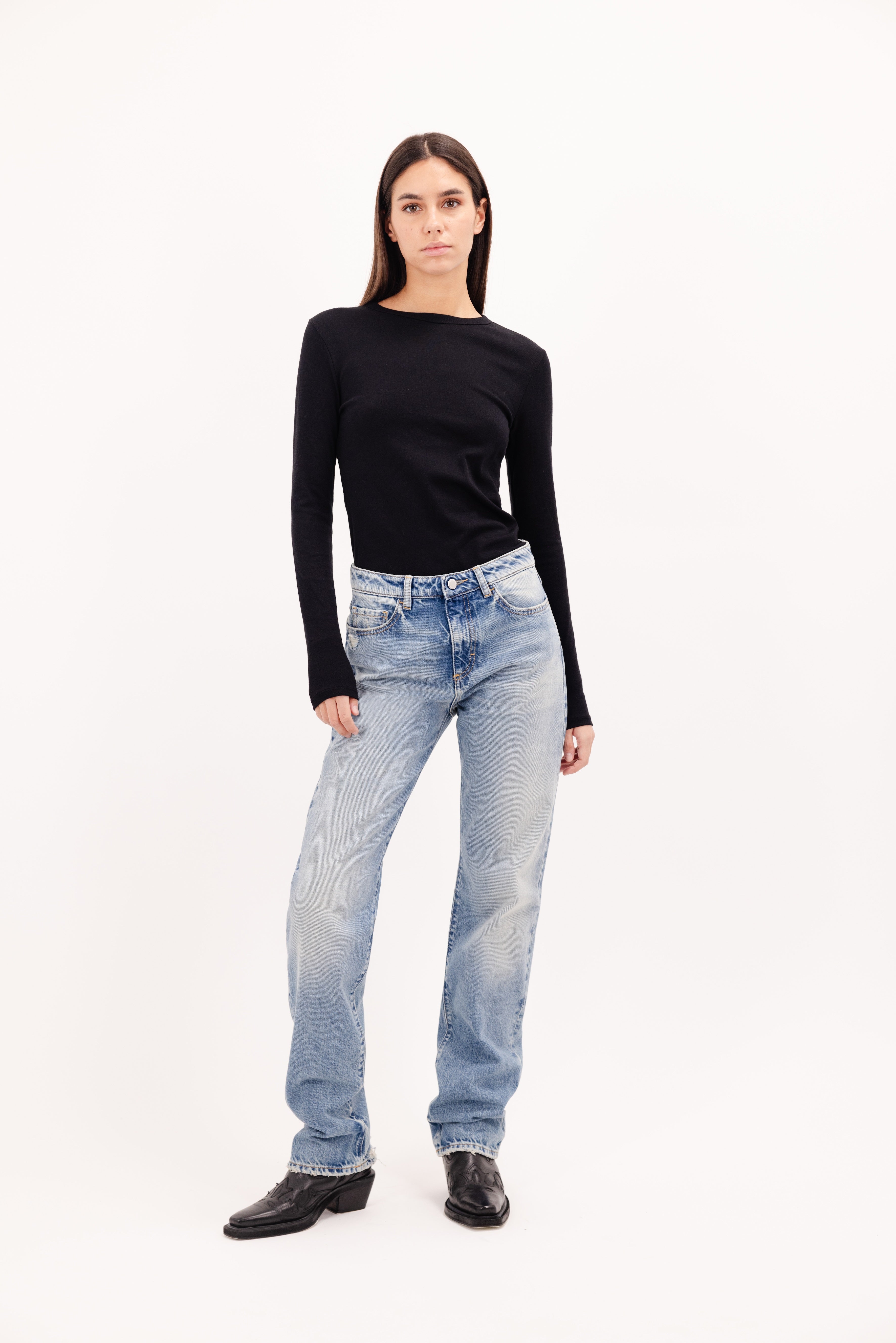 Skye women’s regular jeans in smoke blue wash, 100% rigid cotton denim, worn by a model with a black longsleeve.