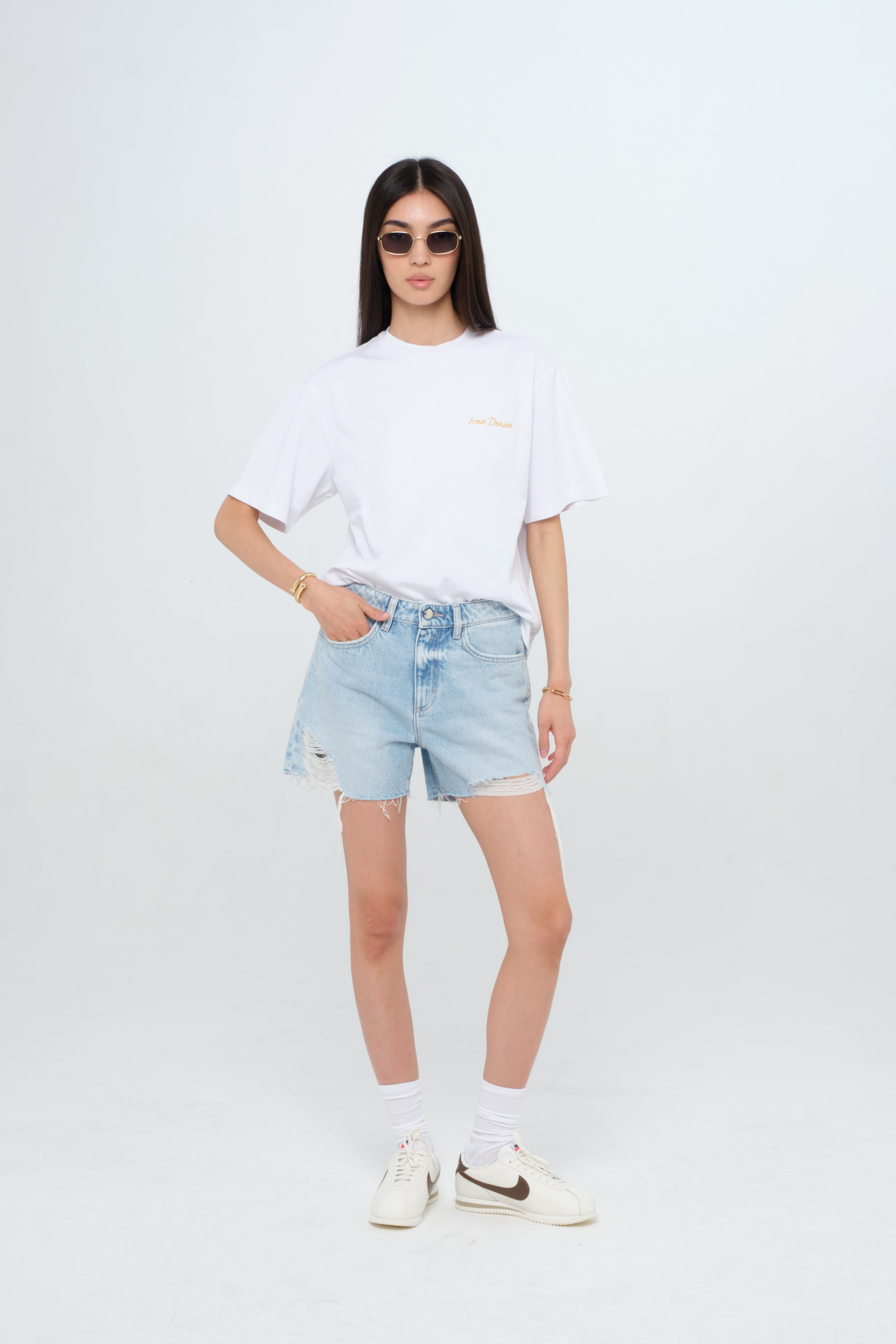 Tam X women’s straight leg short jeans in light wash, 100% rigid cotton denim, worn by a model with a white t-shirt.